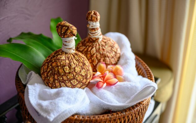 Thai massage with herbal hot compress ball