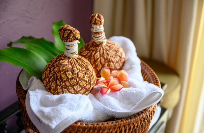 Thai massage with herbal hot compress ball