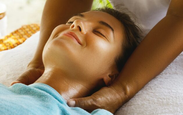 Young caucasian woman during traditional Thai massage