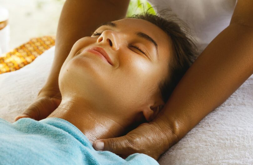 Young caucasian woman during traditional Thai massage